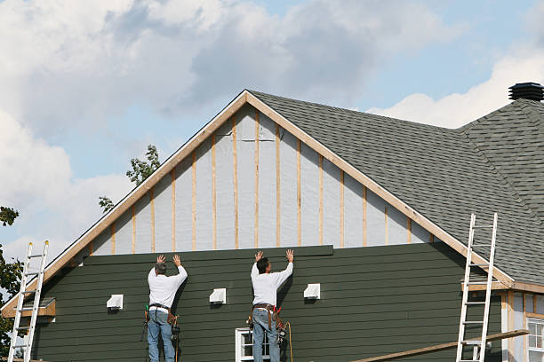Professional Siding Replacement technician working in Mansfield, PA
